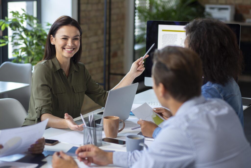 People using digital device while meeting min