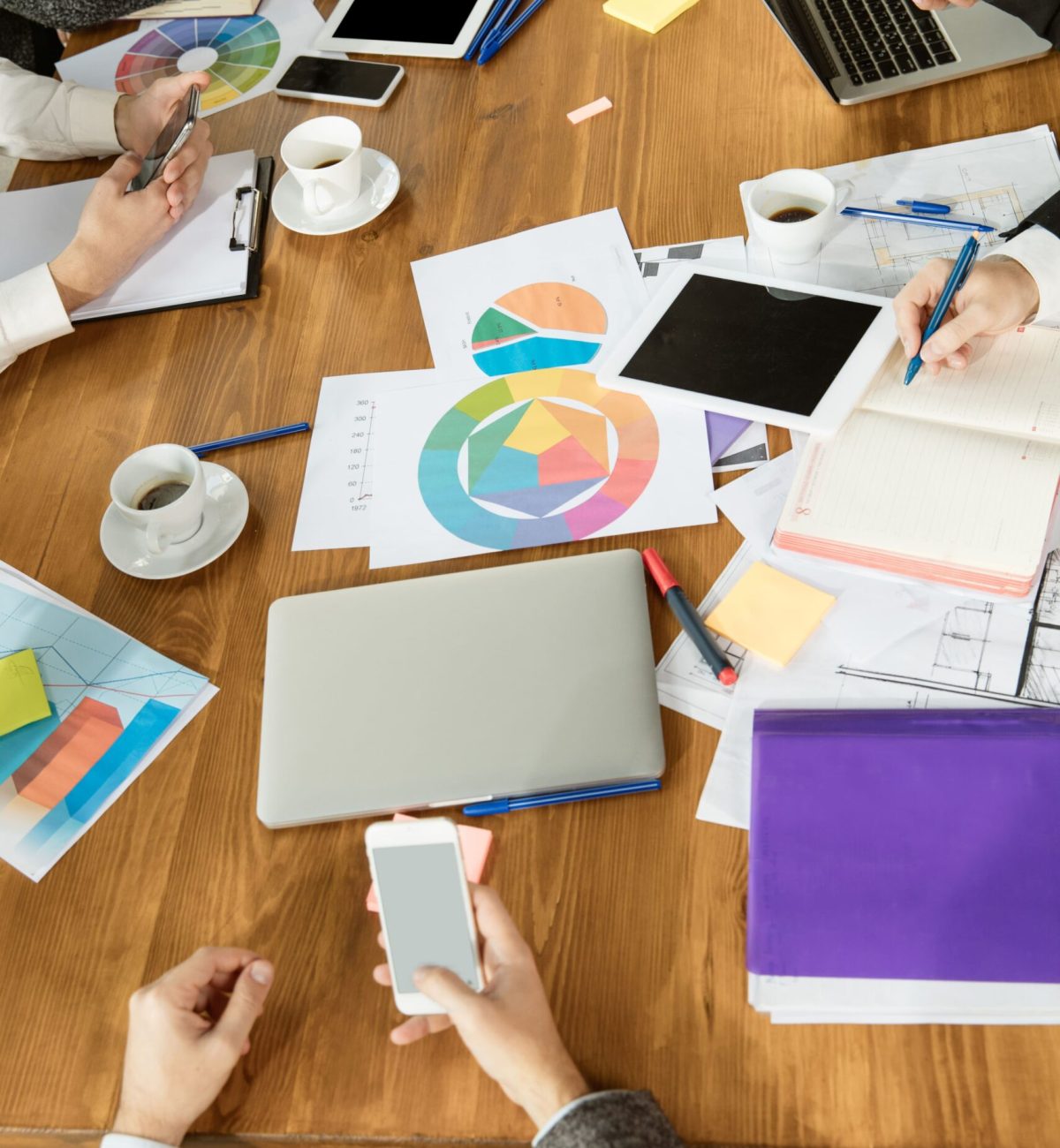 Group young business professionals having meeting diverse group coworkers discuss new decisions future plans strategy creative meeting workplace business finance teamwork top view min