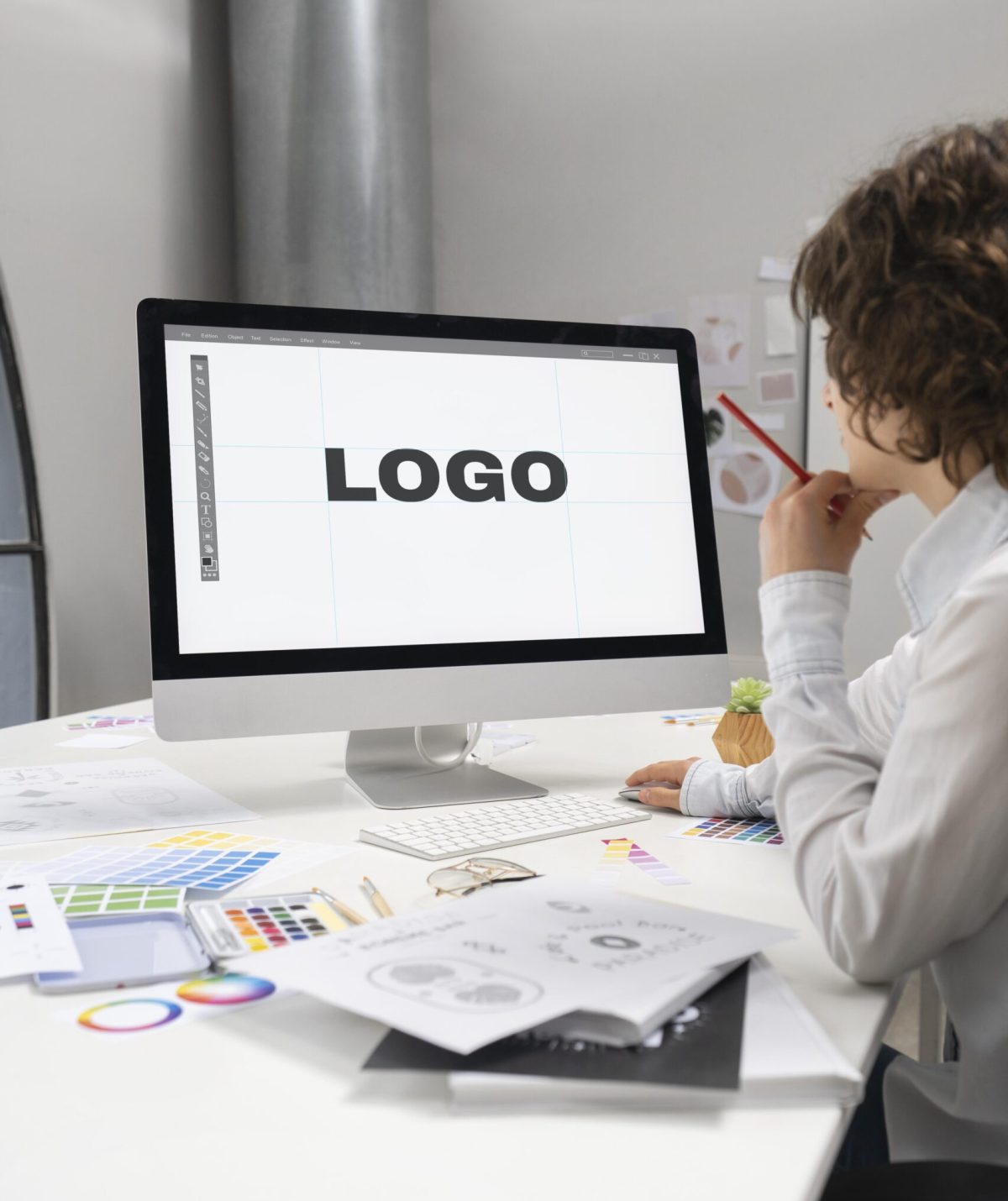 Logo designer working computer desktop