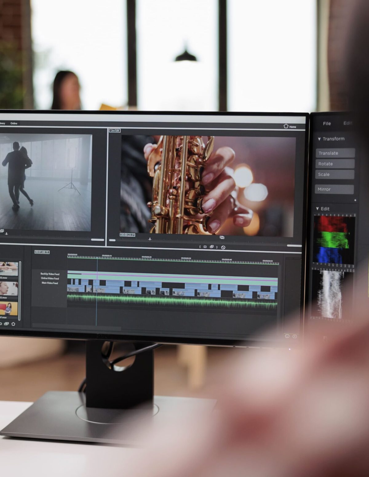 Male videographer editing video montage post production software working computer creating movie content with color grading edit creative multimedia film footage app min