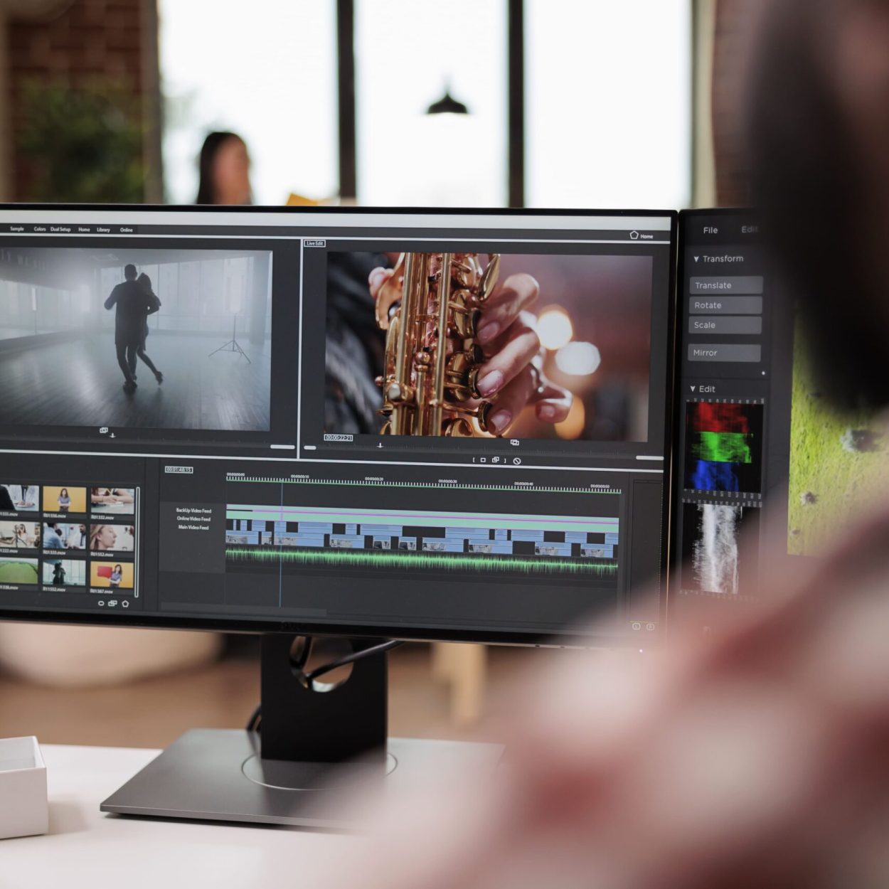 Male videographer editing video montage post production software working computer creating movie content with color grading edit creative multimedia film footage app min