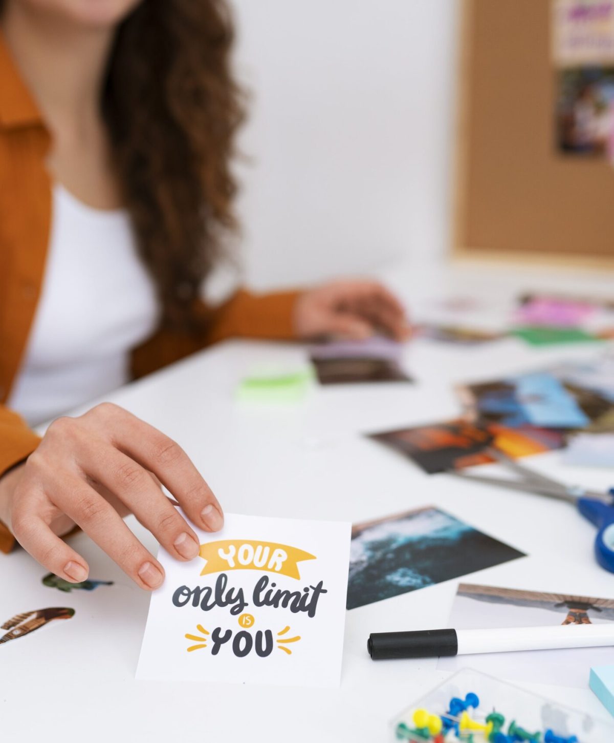 Woman creating inspiring vision board side view min